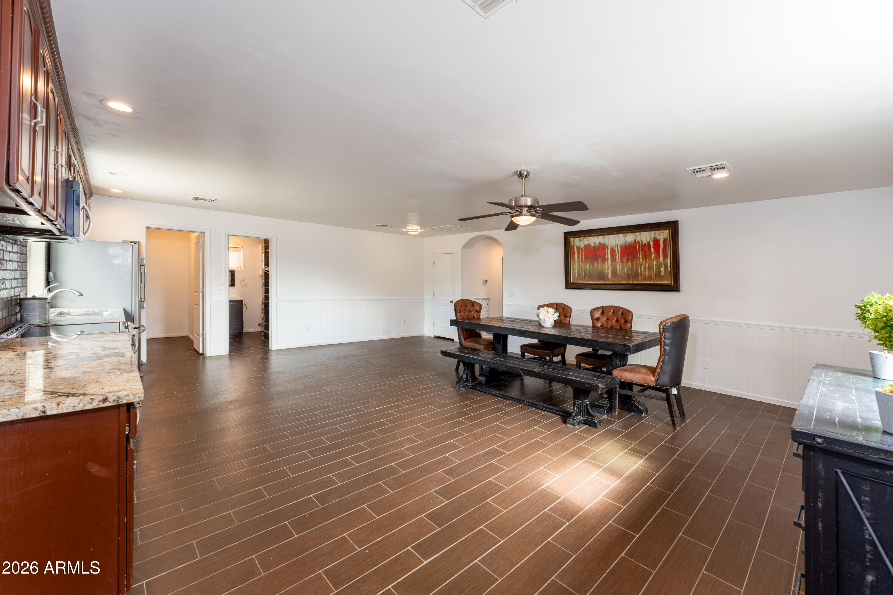 9616 North 11th Avenue Phoenix, AZ 85021 - Photo 20 of 32 a view of a dining room with furniture window and wooden floor