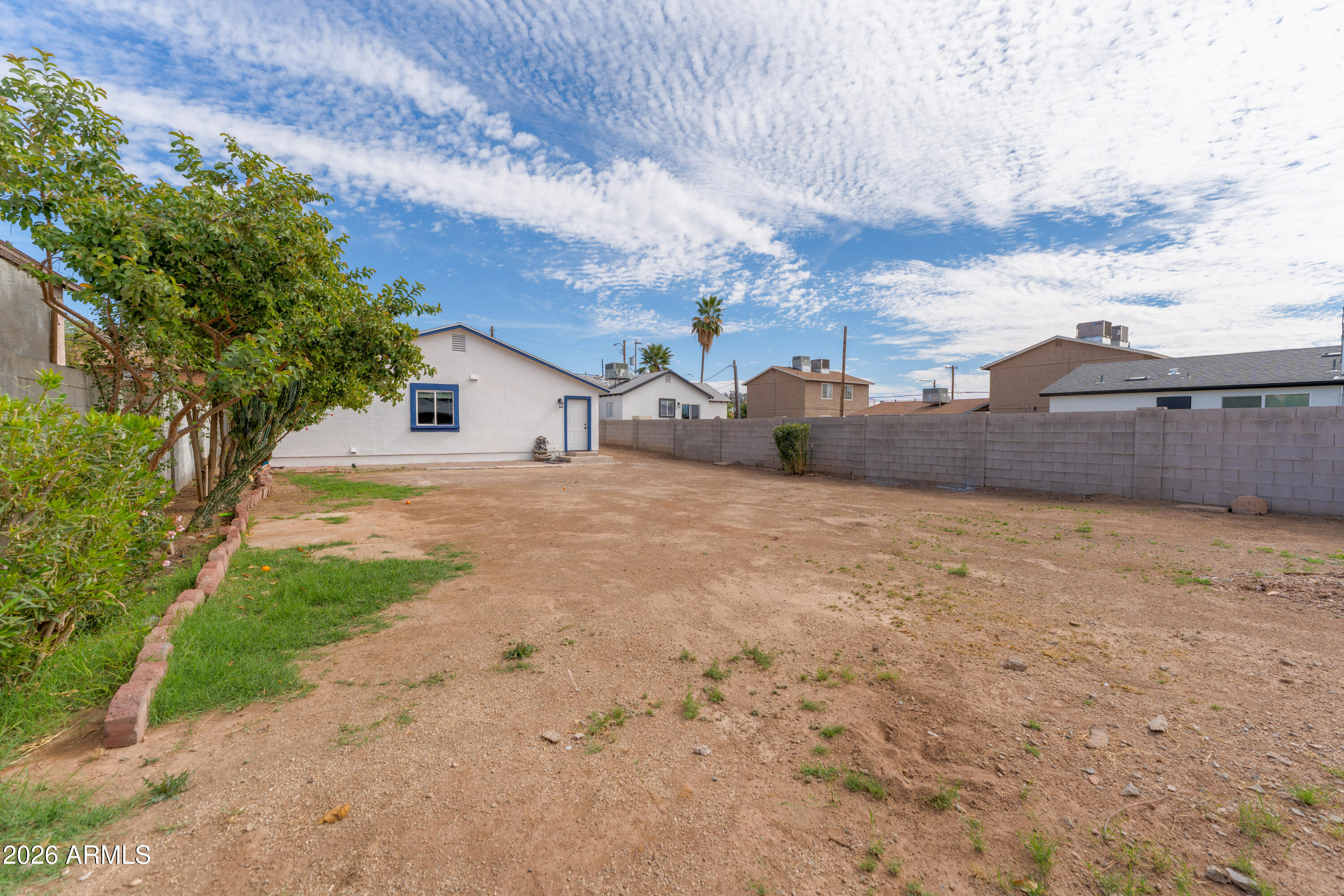 9616 North 11th Avenue Phoenix, AZ 85021 - Photo 25 of 32 a view of a house with a yard
