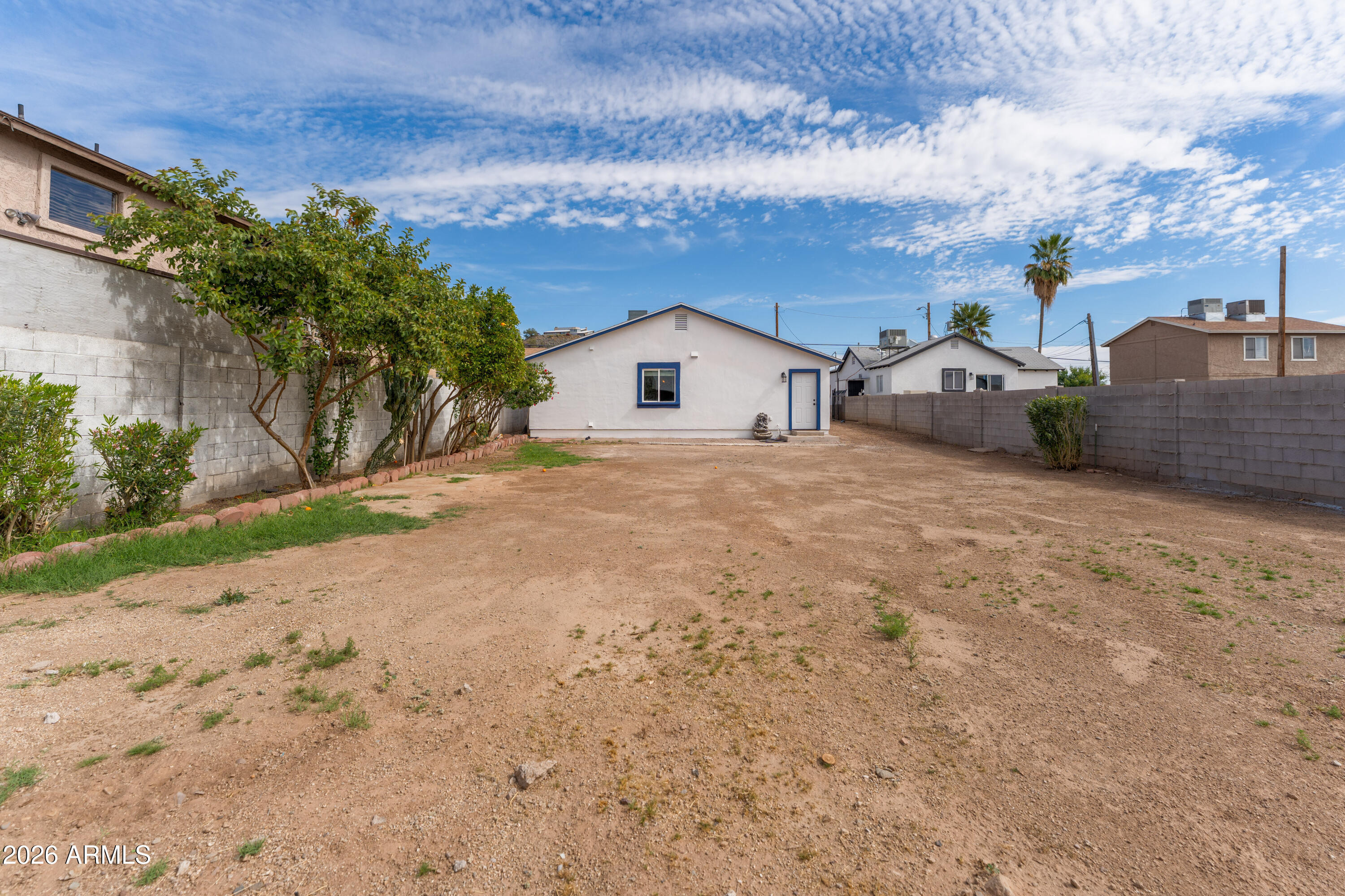 9616 North 11th Avenue Phoenix, AZ 85021 - Photo 26 of 32 a view of a house with a yard