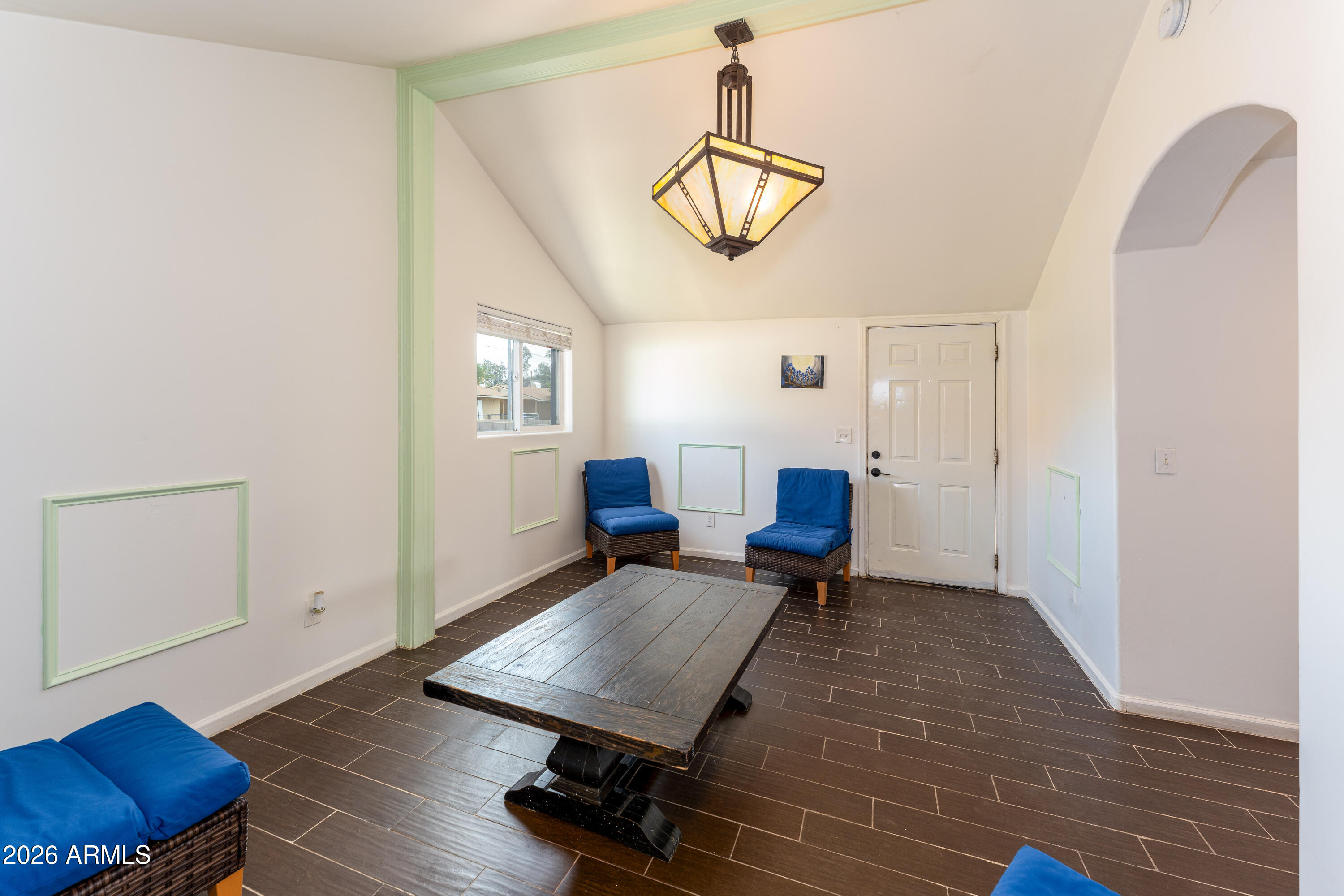 9616 North 11th Avenue Phoenix, AZ 85021 - Photo 7 of 32 a living room with furniture and a wooden floor