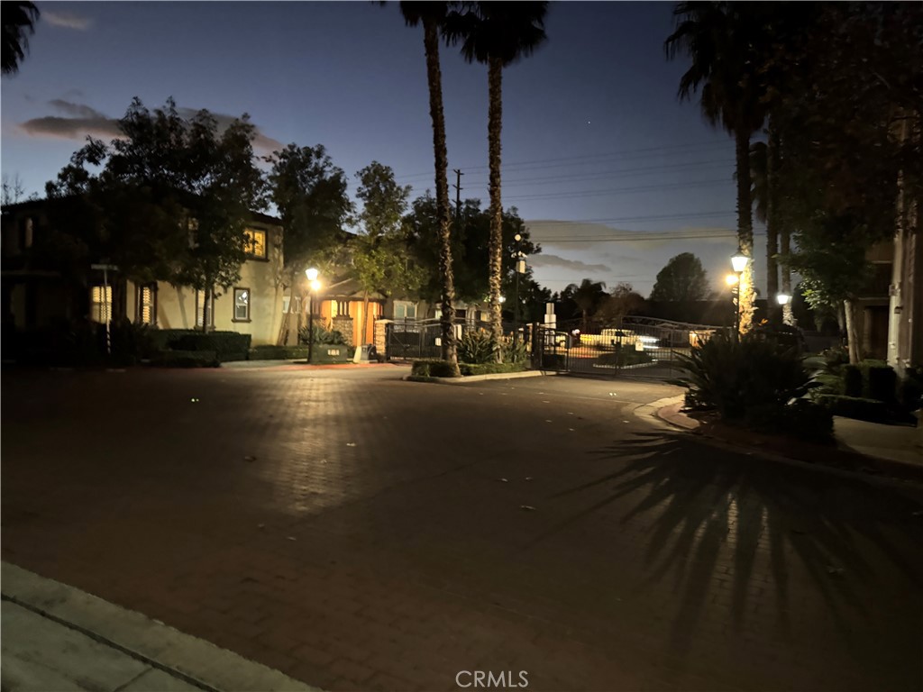a view of a street with cars on both side