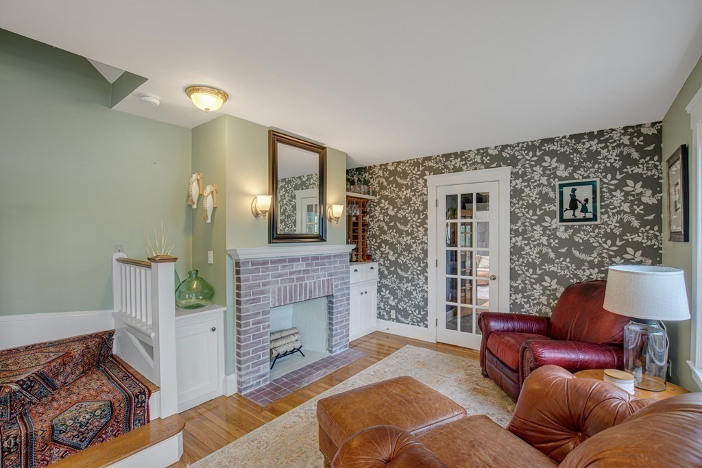 194 Washington Street Boxford, MA 01921 - Photo 12 of 35 a living room with furniture and a fireplace