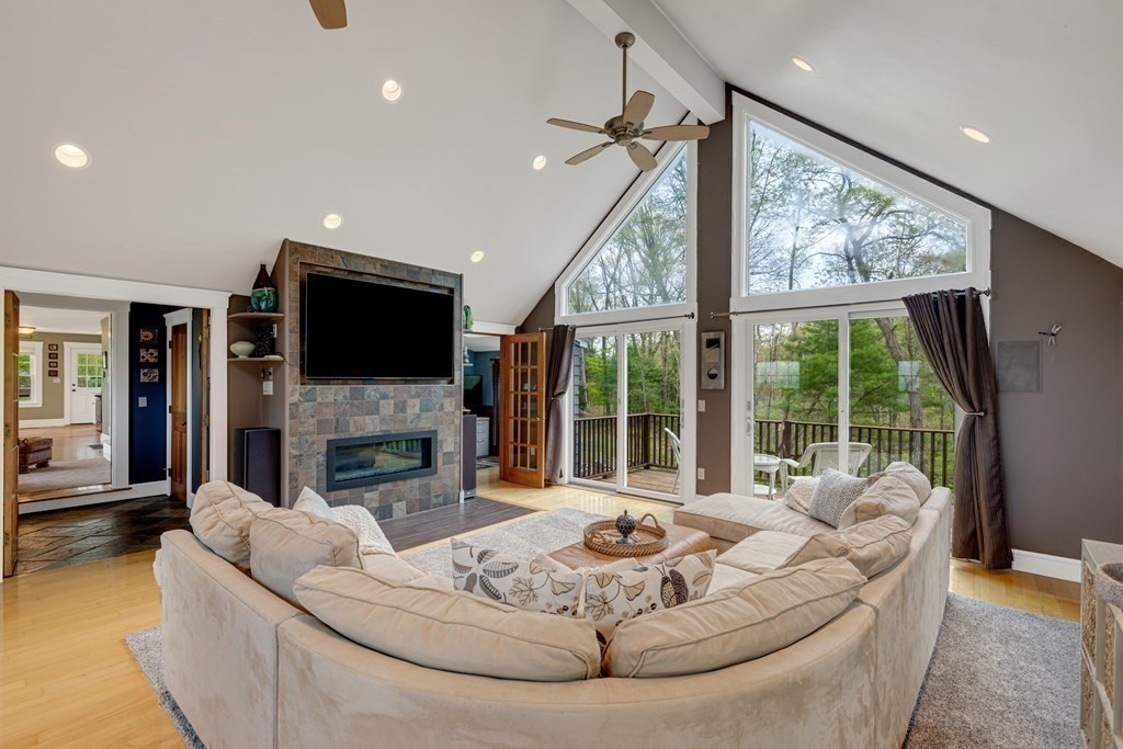 194 Washington Street Boxford, MA 01921 - Photo 14 of 35 a living room with fireplace furniture and a large window