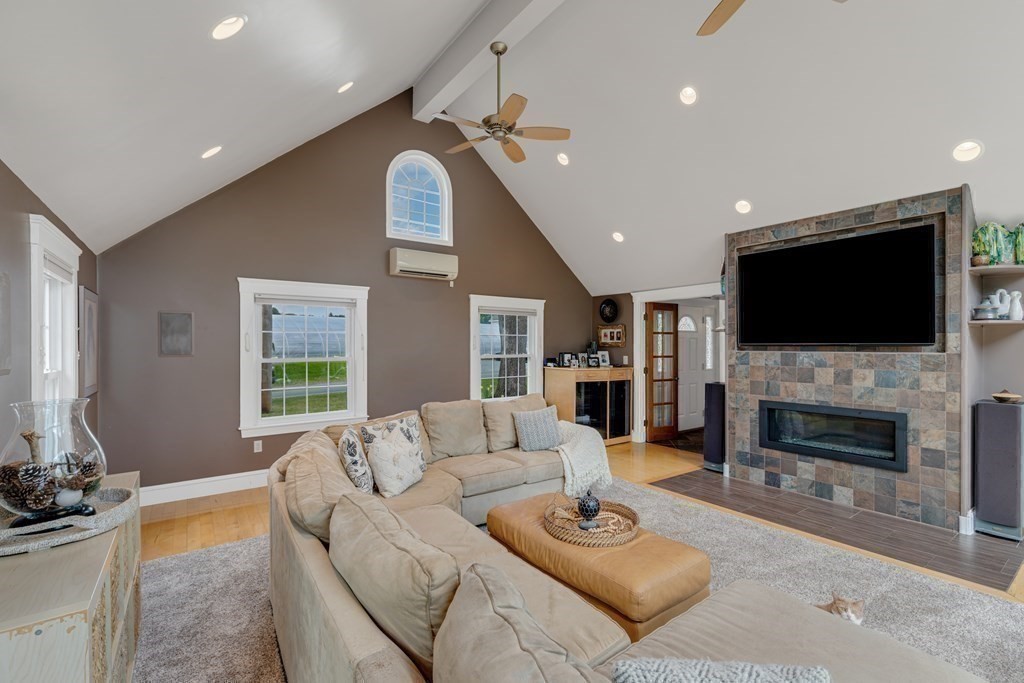 194 Washington Street Boxford, MA 01921 - Photo 15 of 35 a living room with fireplace furniture and a flat screen tv