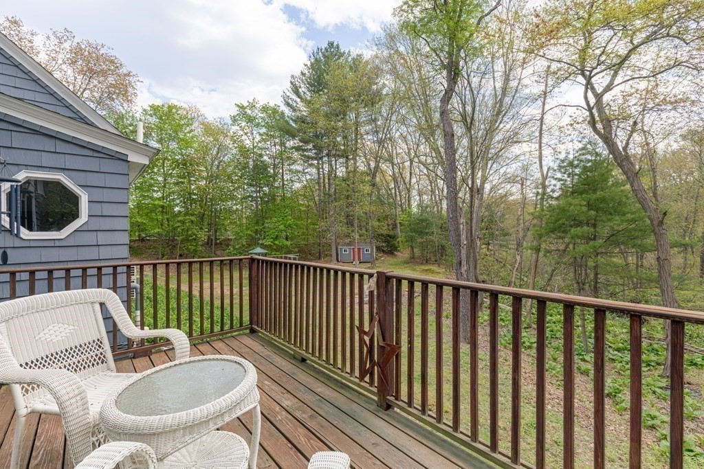 194 Washington Street Boxford, MA 01921 - Photo 17 of 35 a balcony with table and chairs