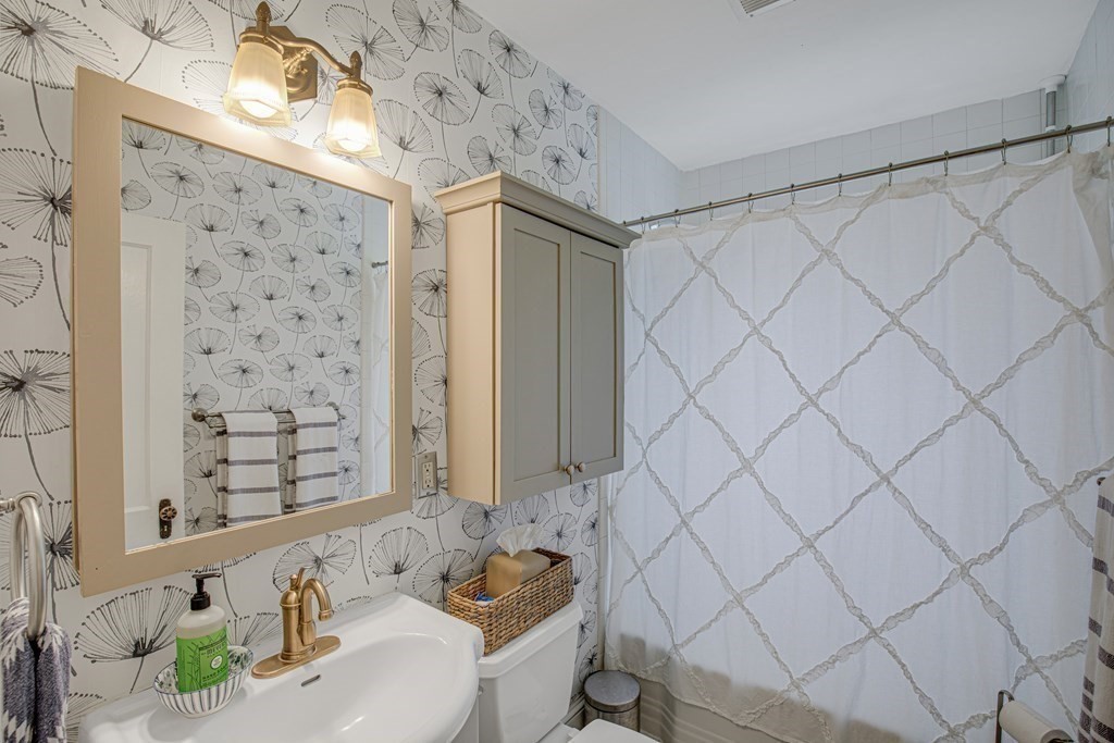 194 Washington Street Boxford, MA 01921 - Photo 20 of 35 a bathroom with a sink toilet and shower