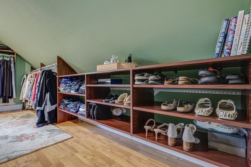 194 Washington Street Boxford, MA 01921 - Photo 26 of 35 a view of walk in closet with clothes and shoes