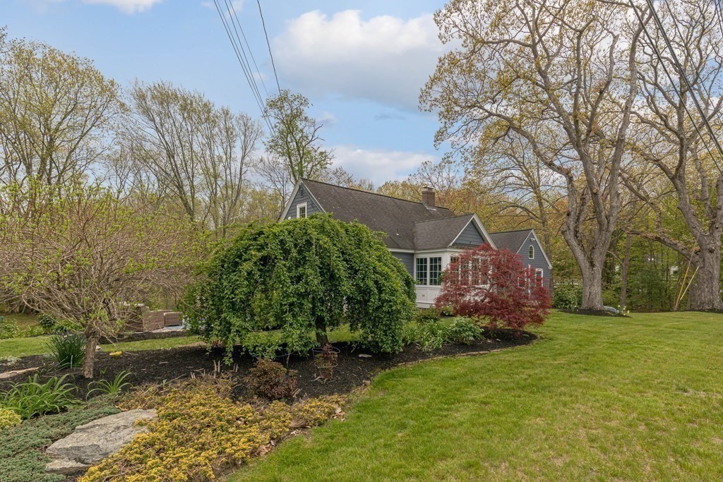194 Washington Street Boxford, MA 01921 - Photo 28 of 35 a backyard of a house with lots of green space