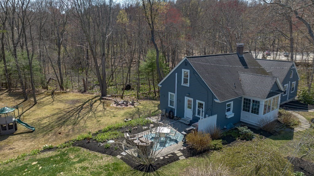 194 Washington Street Boxford, MA 01921 - Photo 30 of 35 a view of house with yard and trees in the background