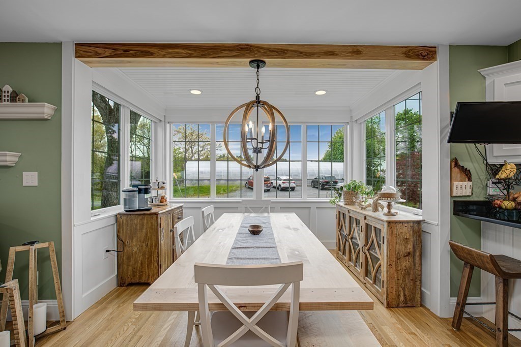 194 Washington Street Boxford, MA 01921 - Photo 4 of 35 a very nice looking dining room with a large window table and chairs