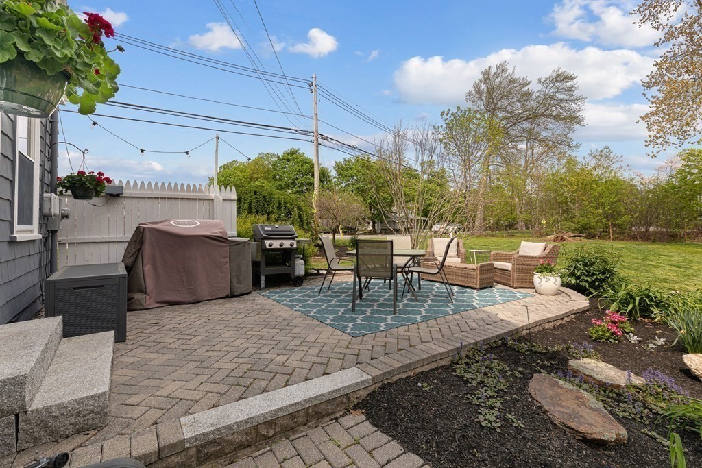 194 Washington Street Boxford, MA 01921 - Photo 9 of 35 a view of a couches and dinning table in patio