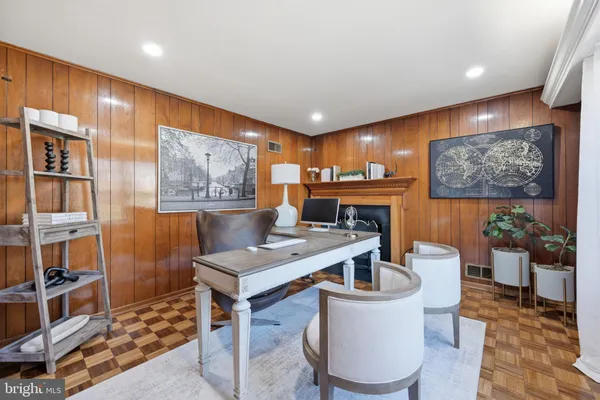 a bathroom with a toilet a sink a mirror and vanity