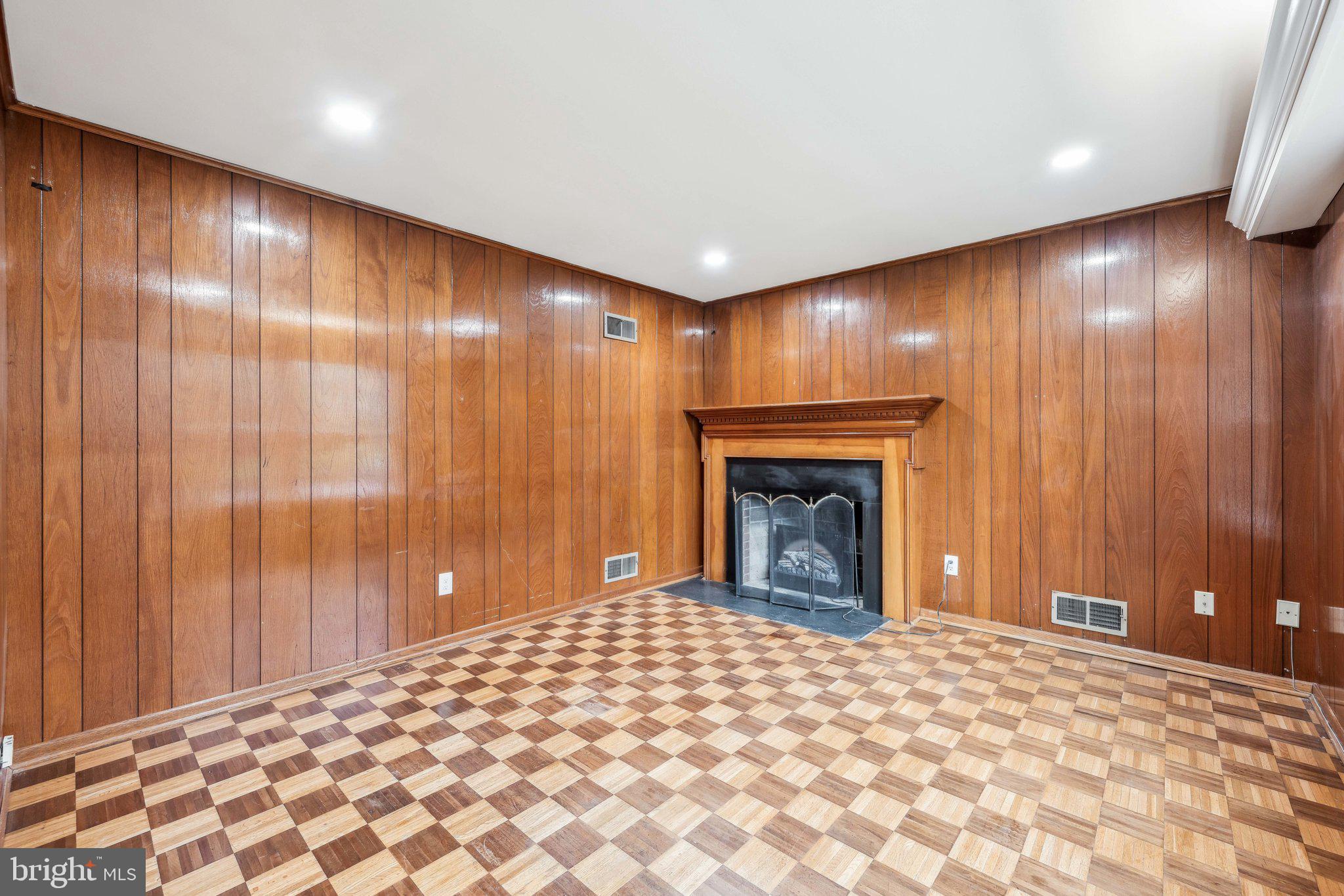 2827 Ellicott Street Northwest Washington, DC 20008 - Photo 20 of 56 a big room with windows and fireplace