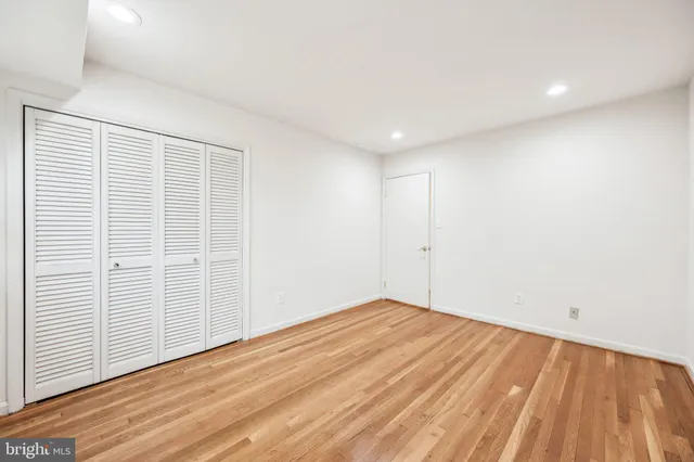 an empty room with wooden floor