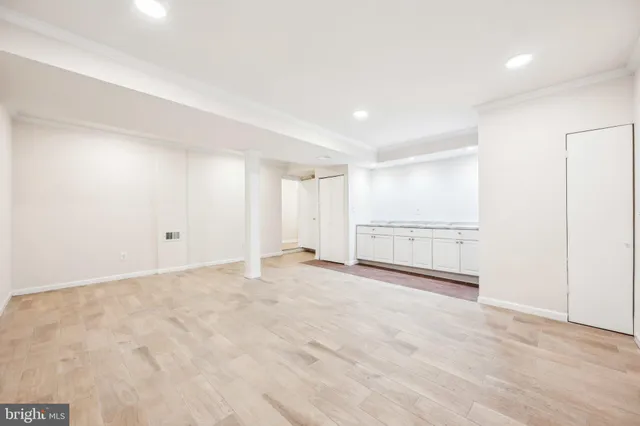 a view of an empty room with a window