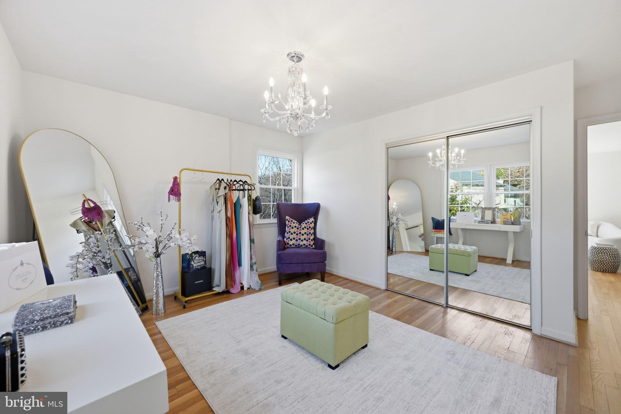 2827 Ellicott Street Northwest Washington, DC 20008 - Photo 53 of 56 a living room with furniture and a chandelier