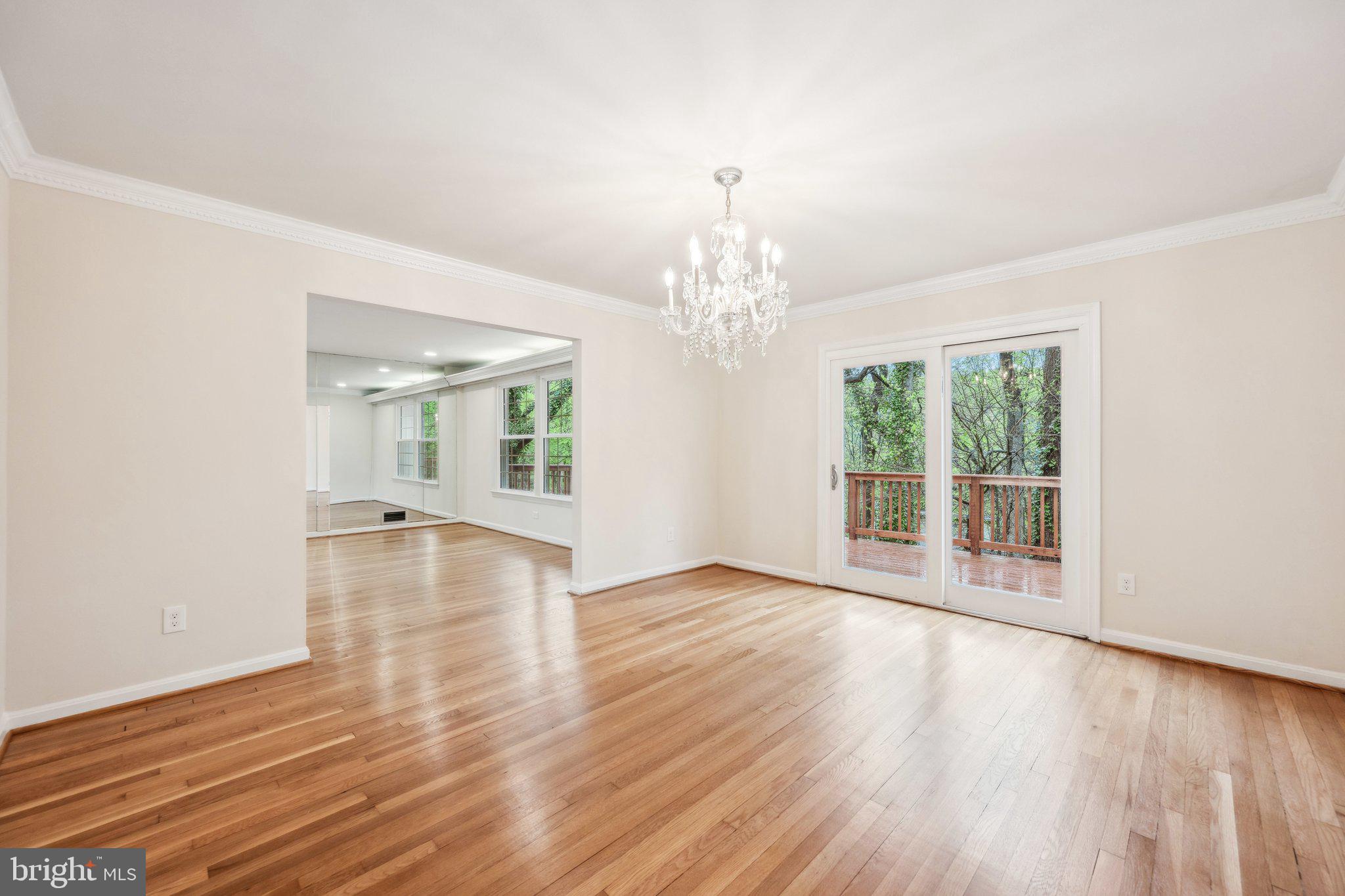 2827 Ellicott Street Northwest Washington, DC 20008 - Photo 9 of 56 a view of a livingroom with wooden floor and a large window