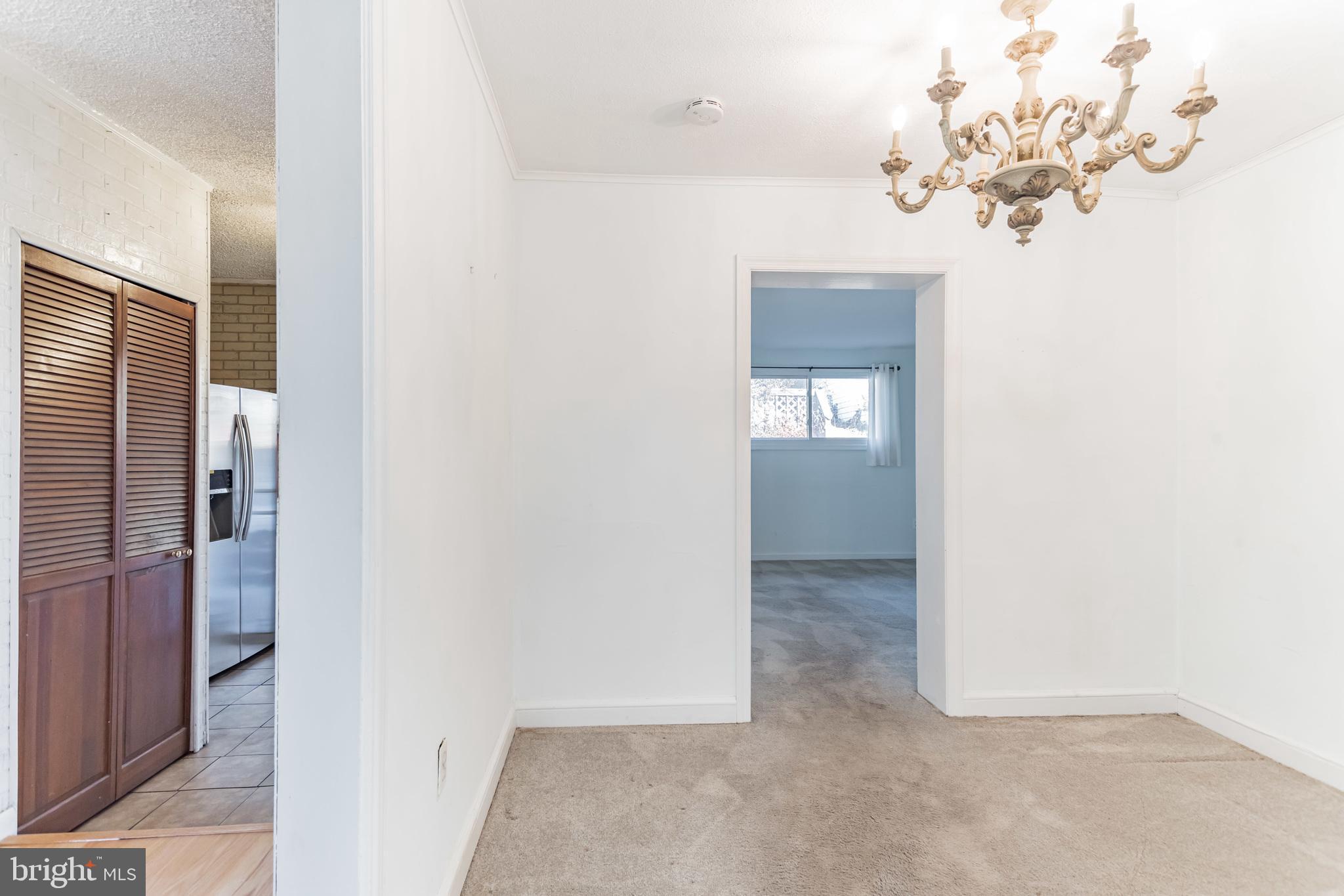101 Melbourne Avenue Silver Spring, MD 20901 - Photo 11 of 30 Dining room leads to kitchen & den