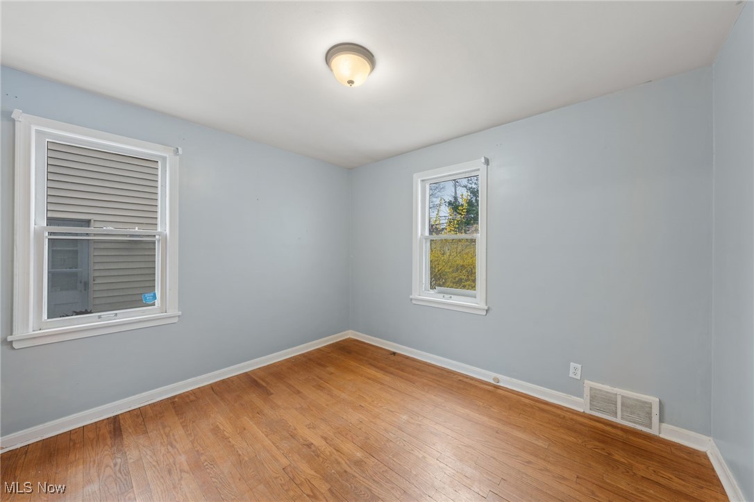 4146 Wyncote Road South Euclid, OH 44121 - Photo 14 of 20 Empty room featuring baseboards, light wood-style flooring, and visible vents