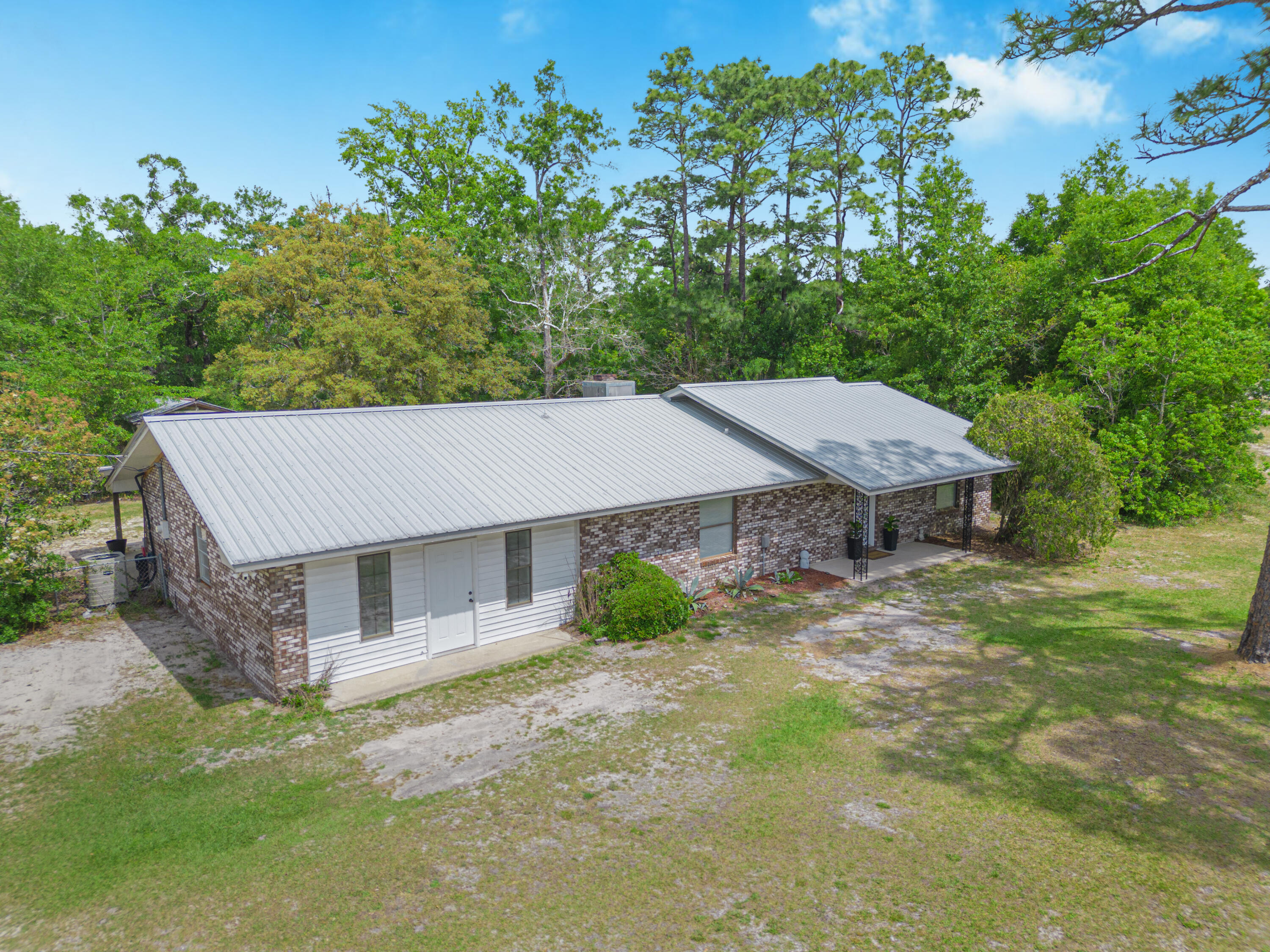 19228 Highway 331 Freeport, FL 32439 - Photo 11 of 26 front view of a house with a yard