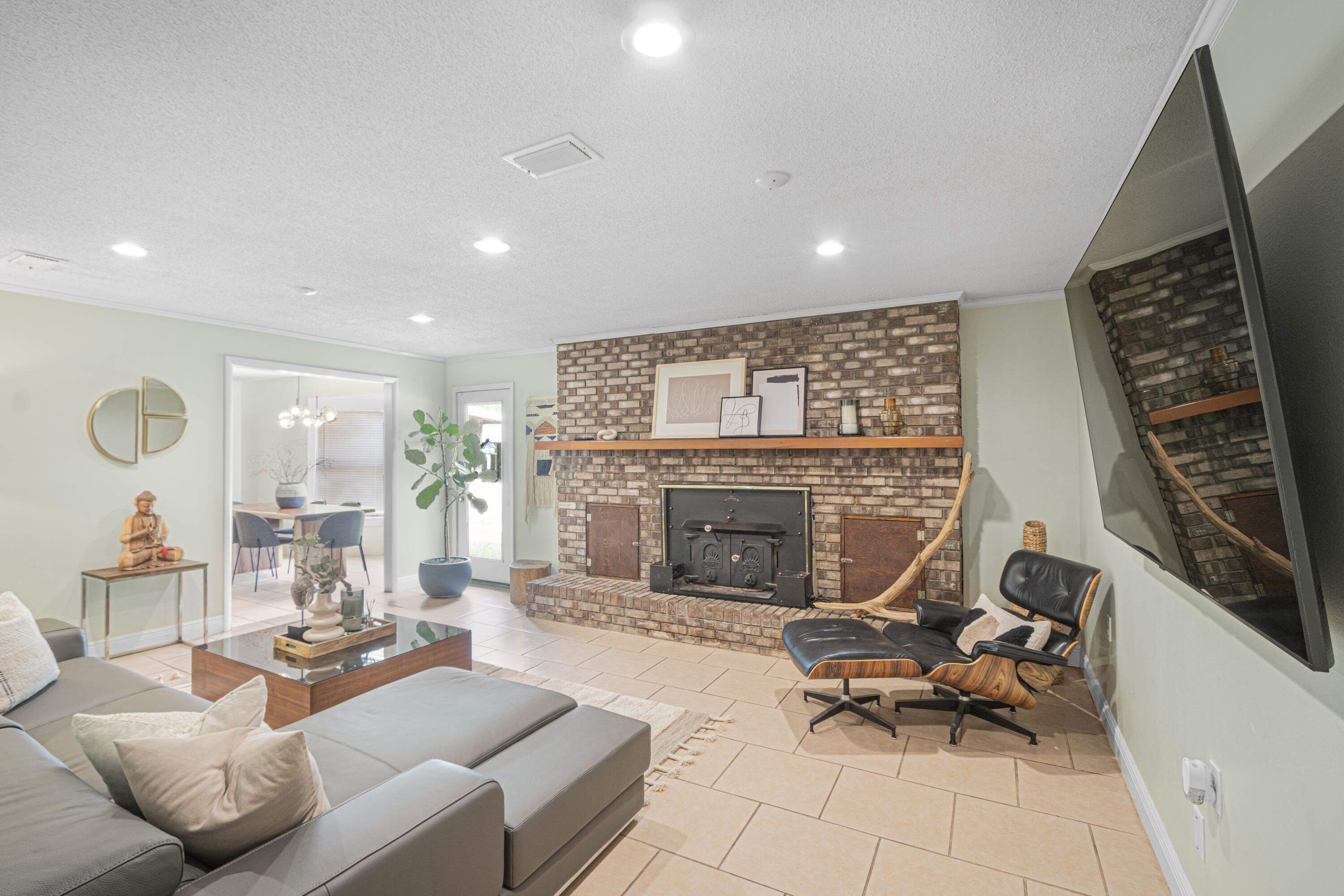 19228 Highway 331 Freeport, FL 32439 - Photo 18 of 26 a living room with furniture a fireplace and a table