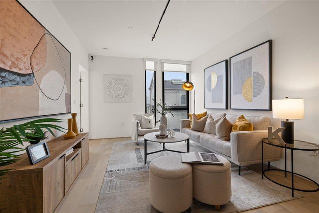 a vase of flowers sitting on a table near a window