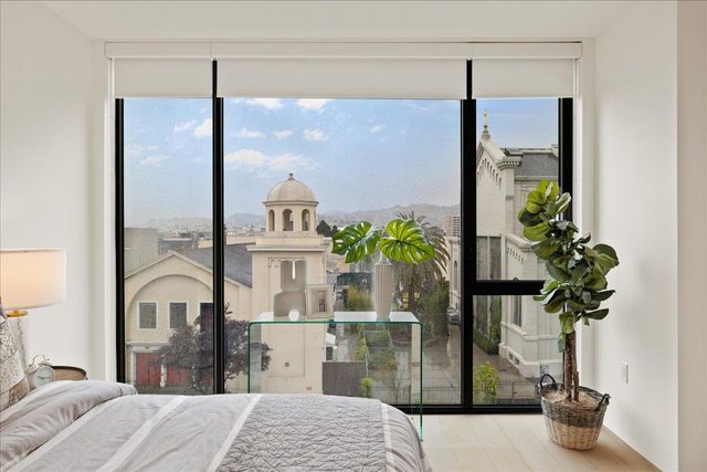 a bathroom with a double vanity sink toilet and shower