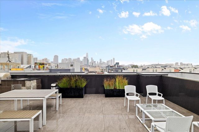a couple of chairs sitting in patio of a house