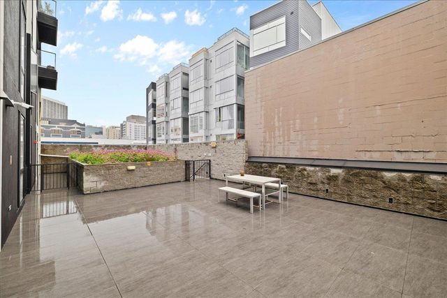 a view of walk in closet and living room