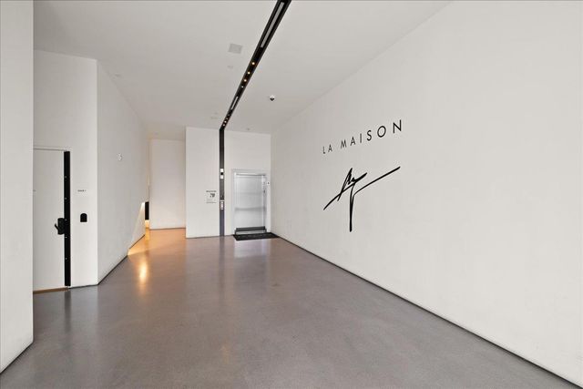 a view of a hallway with a white door