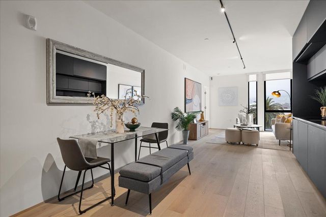 a kitchen with a sink cabinets and window