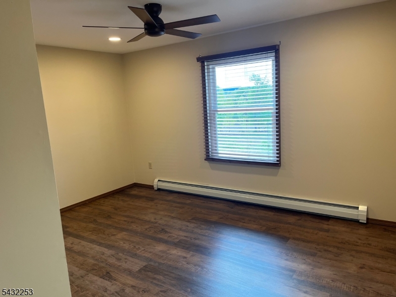 31 Countryside Road Columbia, NJ 07832 - Photo 5 of 31 an empty room with wooden floor and windows