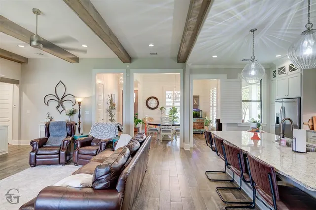 a very nice looking living room with furniture and a large window