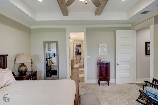 a living room with furniture and a lamp