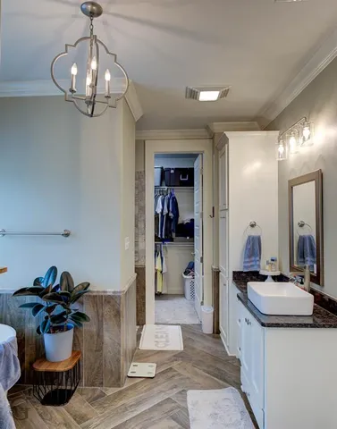 a view of a hallway and a kitchen area