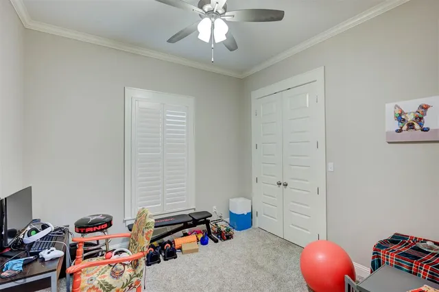 a bedroom with a workspace