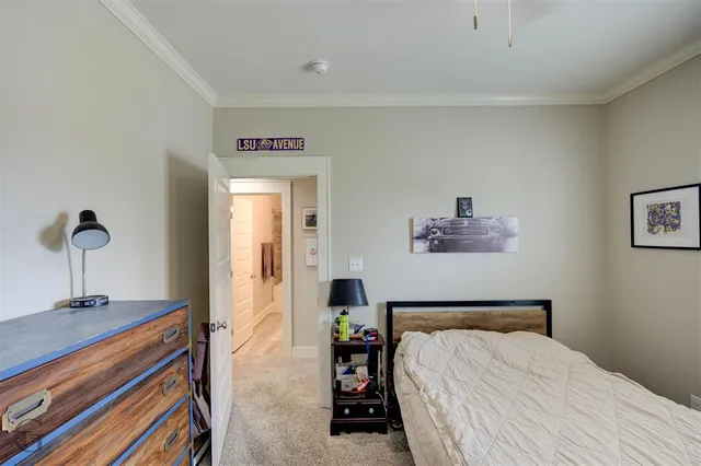 a bedroom with a bed and a mirror