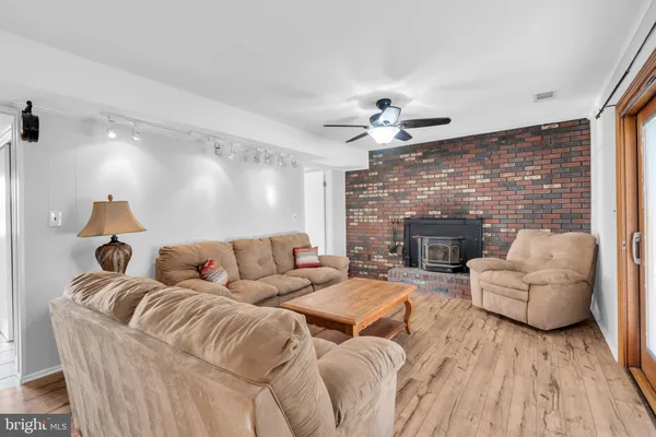 a living room with furniture fireplace and a fireplace