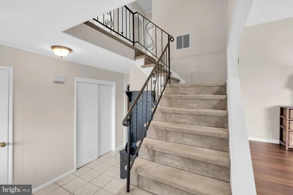 a view of entryway with wooden floor