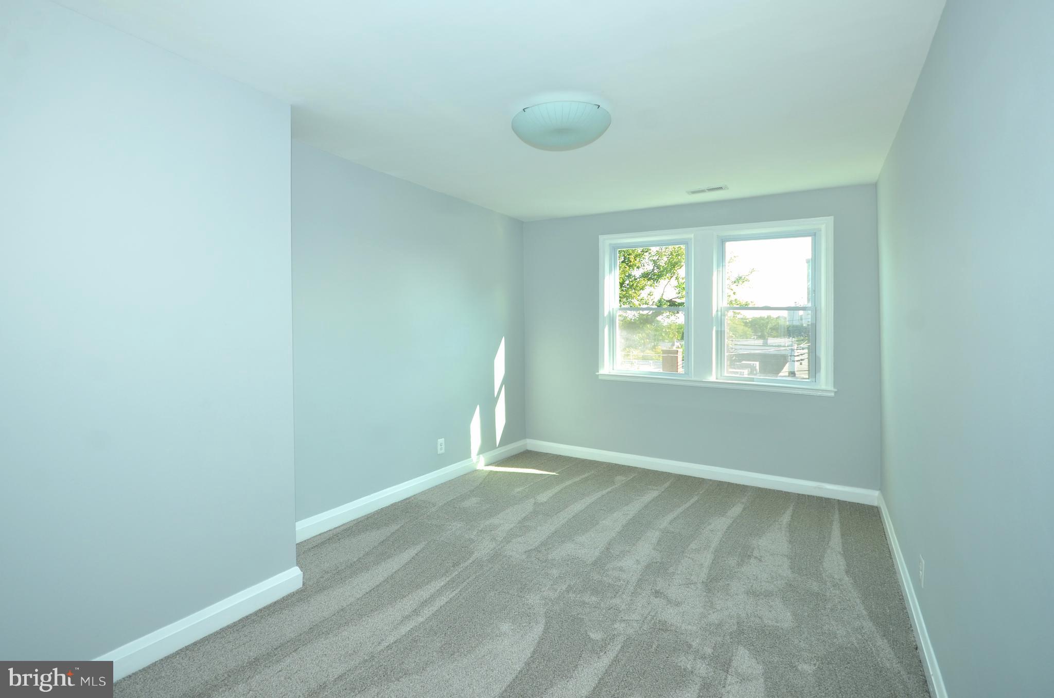 1527 Sheffield Road Baltimore, MD 21218 - Photo 14 of 28 an empty room with windows