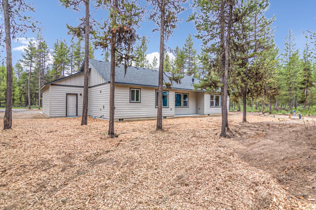 17084 Indio Road Bend, OR 97707 - Photo 40 of 40 front view of a house with a large tree