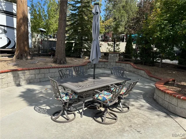 a view of a backyard with sitting area