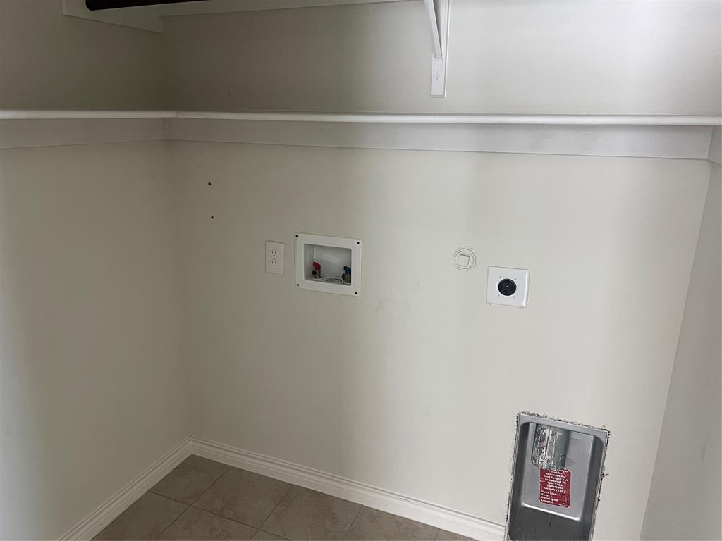 1821 Ferguson Lane McKinney, TX 75071 - Photo 11 of 26 a view of a closet with wooden floor