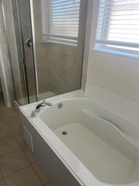 1821 Ferguson Lane McKinney, TX 75071 - Photo 16 of 26 a bath tub sitting next to a shower
