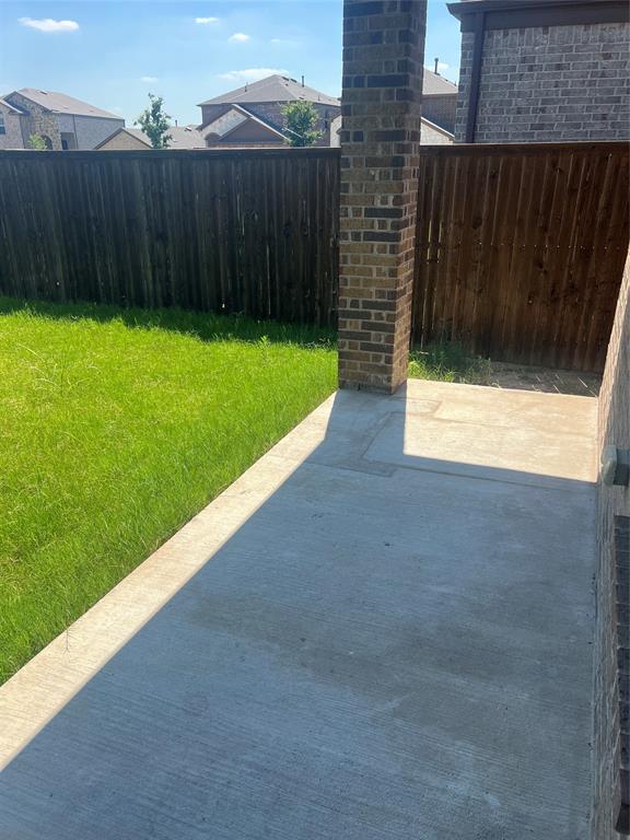 1821 Ferguson Lane McKinney, TX 75071 - Photo 17 of 26 a view of a backyard with wooden fence