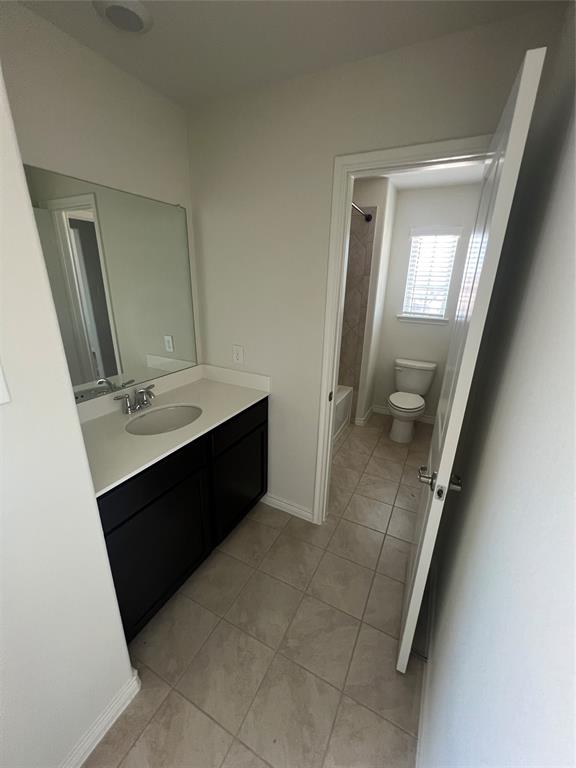 1821 Ferguson Lane McKinney, TX 75071 - Photo 24 of 26 a bathroom with a double vanity sink and mirror