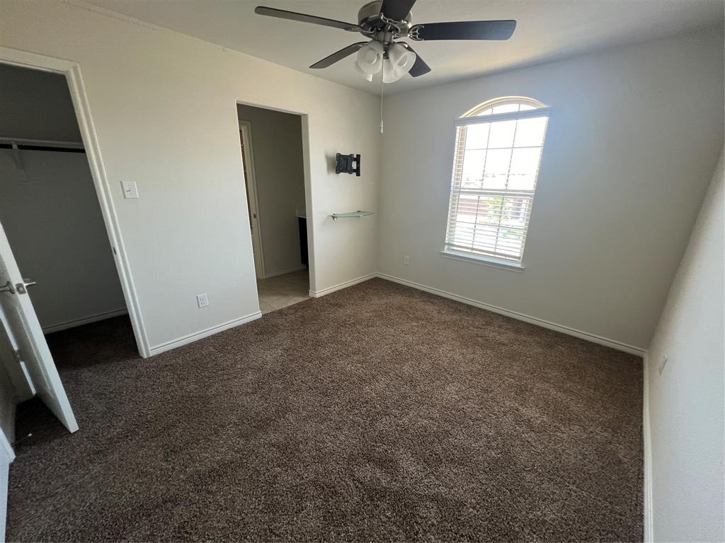 1821 Ferguson Lane McKinney, TX 75071 - Photo 26 of 26 an empty room with windows and fan