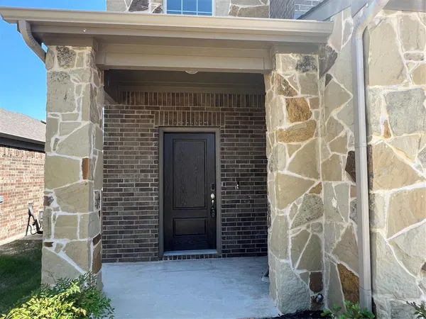 a front view of a house with a glass door