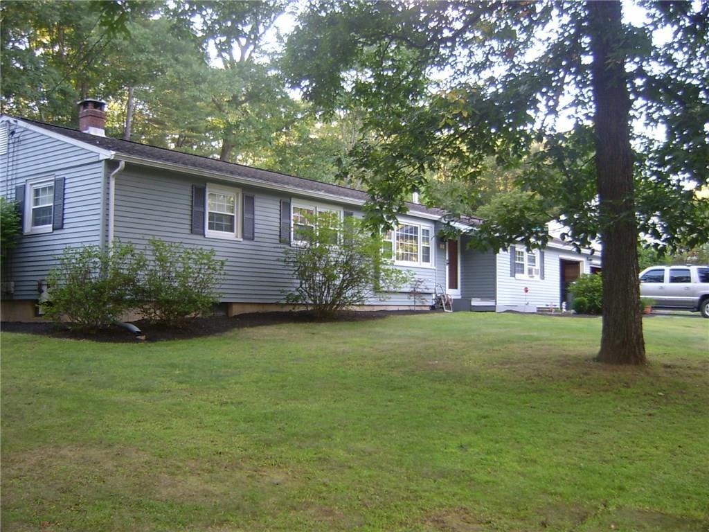 75 Beacon Road Windham, CT 06280 - Photo 1 of 1 a front view of a house with garden