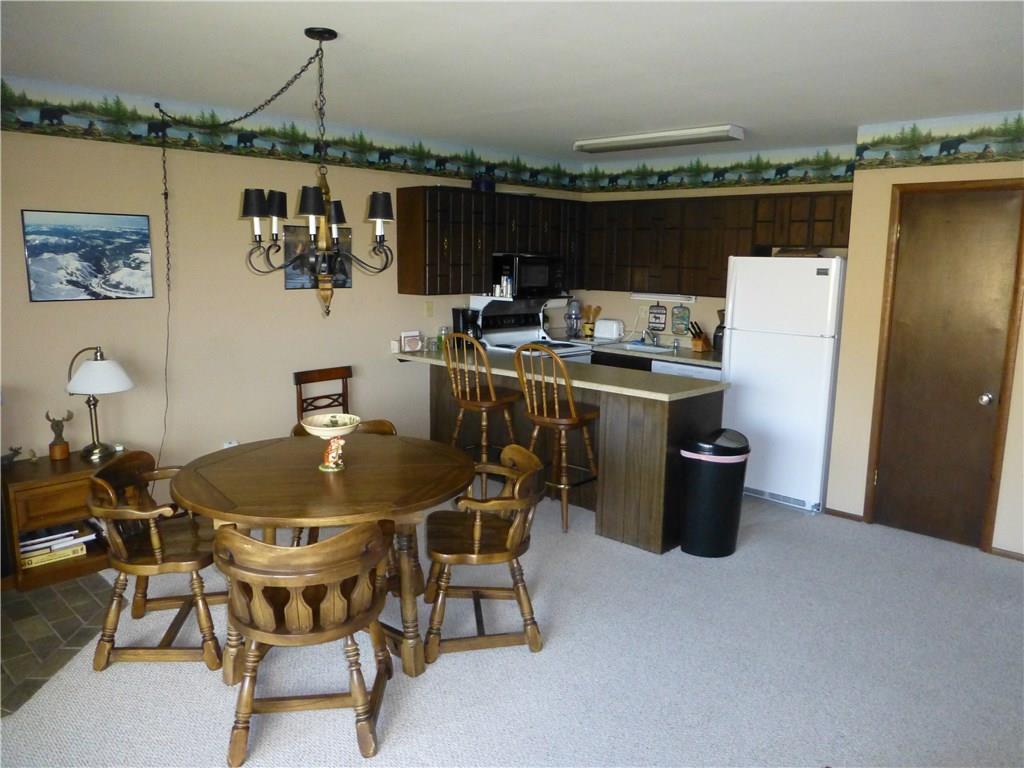 110 Evergreen Road, Unit B303 Dillon, CO 80435 - Photo 2 of 21 a dinning table and chairs in a terrace